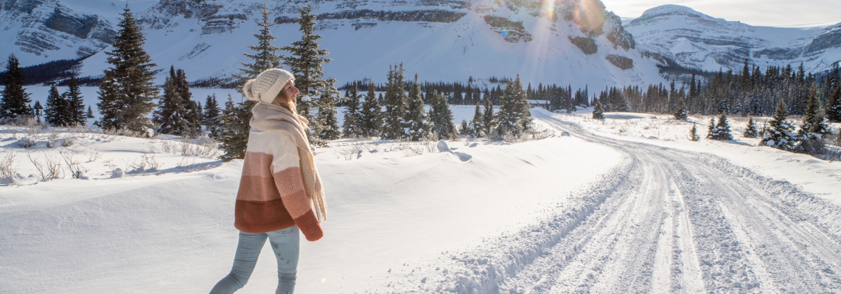 A young woman walking in snowy Belgrade Montana.